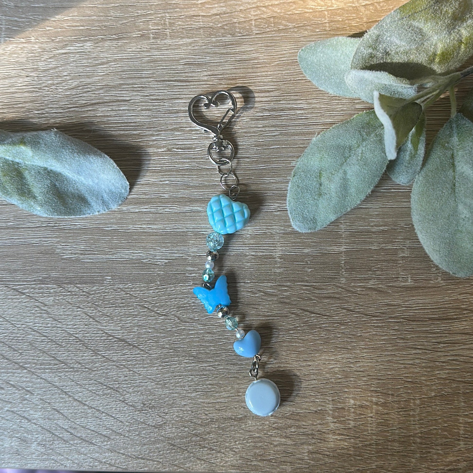 keychain with turquoise beads on a wooden surface